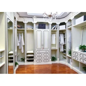 Custom white walk-in wardrobe with corner cabinets, drawers.