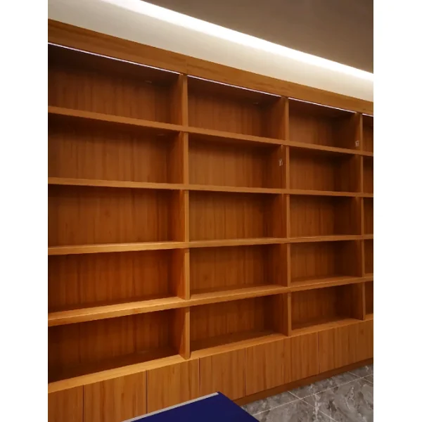 Custom wooden open cabinet with LED strip lighting on top，and grey marble flooring — modern commercial wood cabinetry project.